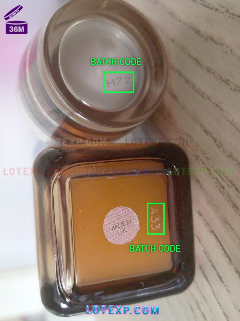 Estee Lauder Expiry Date 16 An Estee Lauder Pleasures perfume bottle on a vanity.