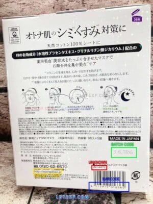 Hand holding a Japan Gals facial sheet mask packaging, showing a batch code.